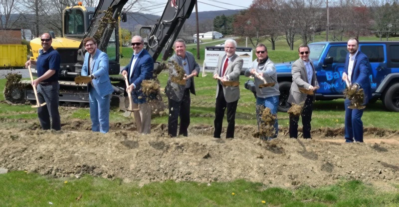 Representatives from F&M Trust, Lower Paxton Township, Campbell Commercial Partners LLC, and A.P. Williams Construction throw the first shovels of dirt at the site of a future F&M Trust community office at 4765 Linglestown Road in Harrisburg.