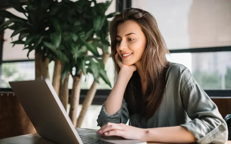 Woman using a laptop at a desk
