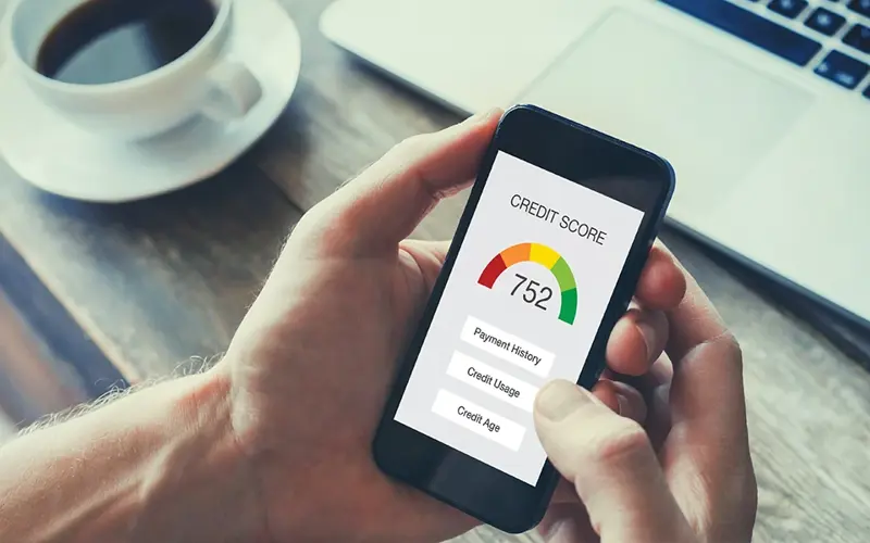 mobile phone displaying person's credit score