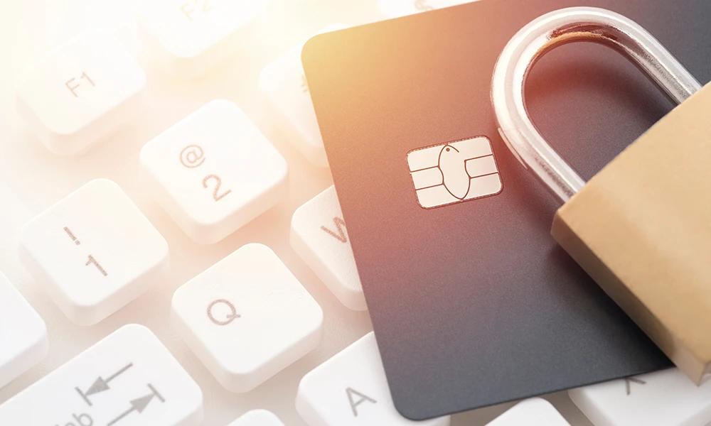 a keyboard, credit card and a pad lock