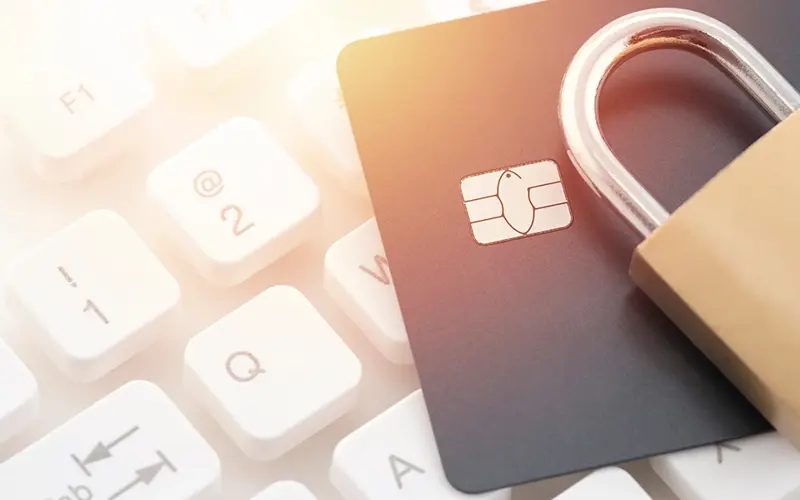 a keyboard, credit card and a pad lock