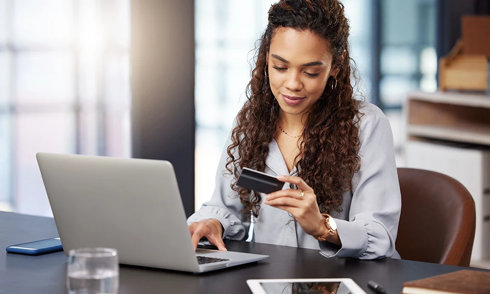 young woman making an online purchase with credit card
