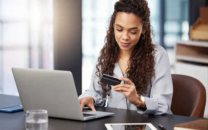 young woman making an online purchase with credit card