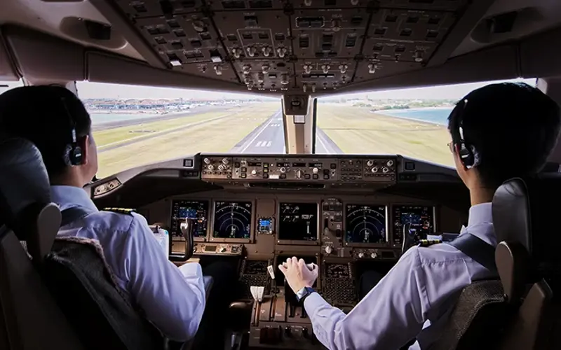 cockpit of an airplane controlled by two pilots