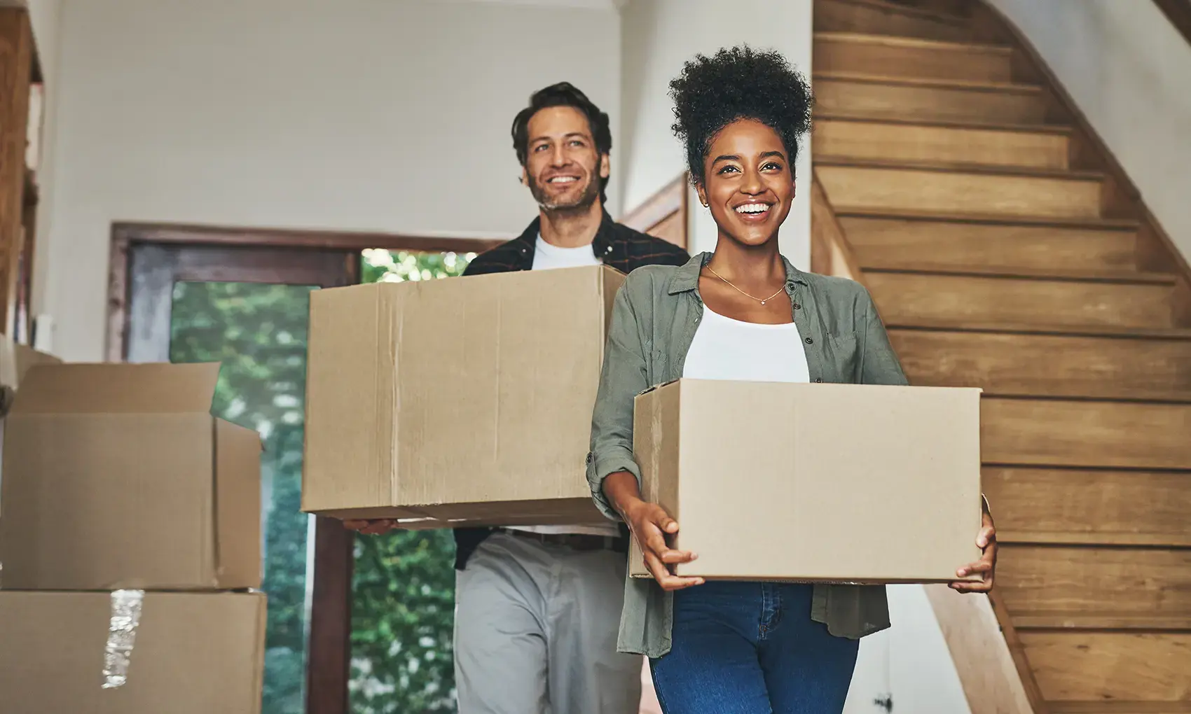 Man and woman moving into a home