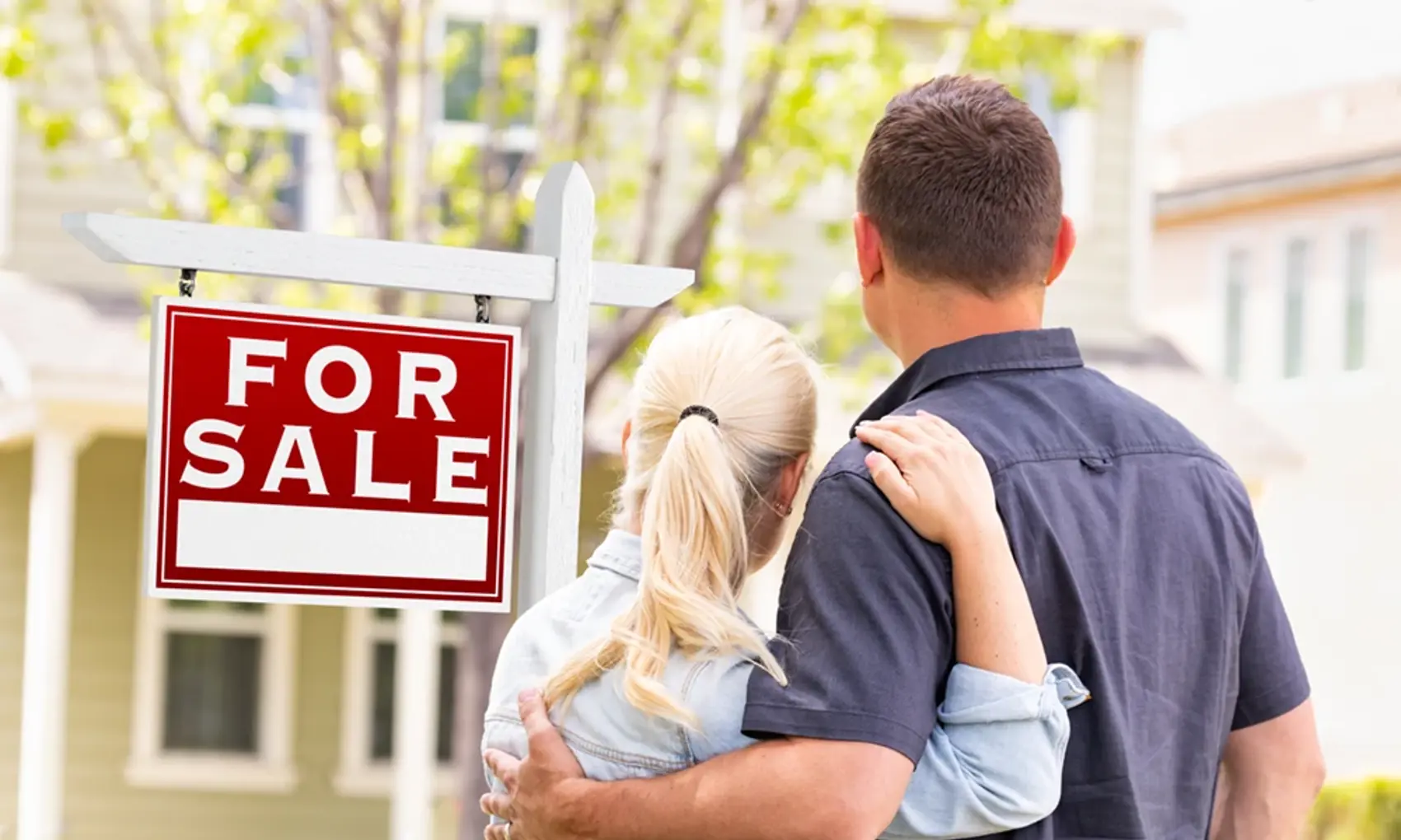 Man and woman admiring recent purchased home