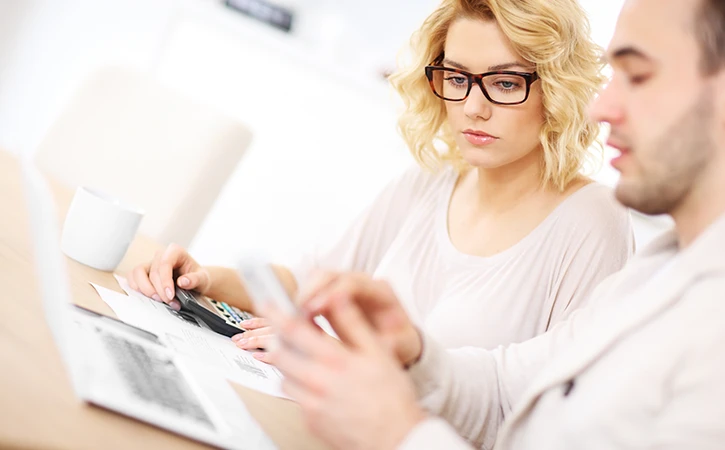 woman with her partner looking at bills