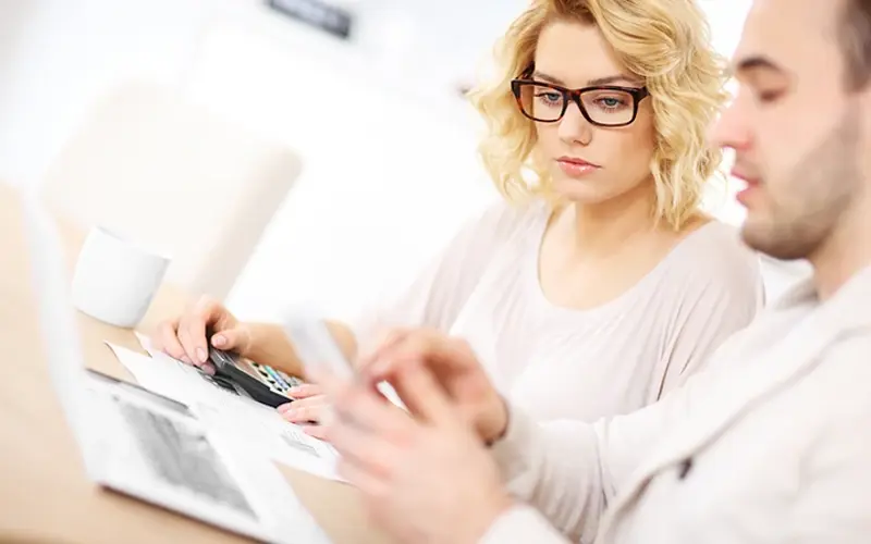 woman with her partner looking at bills