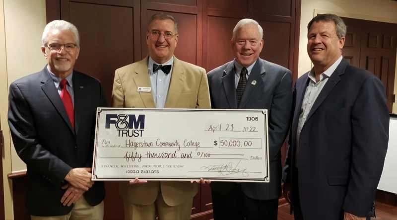 Representatives from F&M Trust and Hagerstown Community College pose for a photo with the $50,000 donation from F&M Trust From left: Warren Elliott, Chairman of the Board, Franklin Financial Services Corporation; Dr. James Klauber, President, Hagerstown Community College; John Williamson, Chairman, Board of Trustees, Hagerstown Community College; and Tim Henry, President and CEO, F&M Trust.
