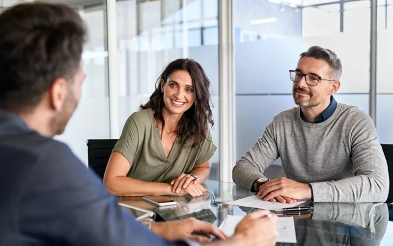 Man and woman meeting with consultant
