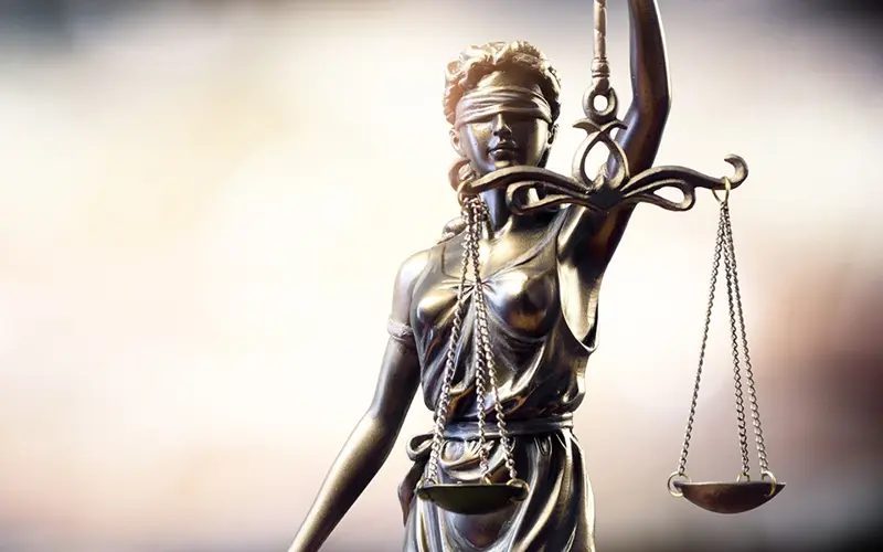Lady Justice balancing the scales