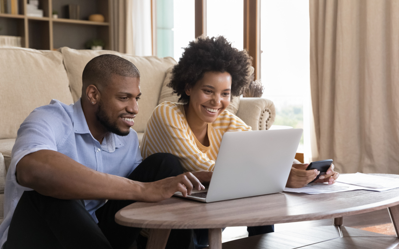 Man and woman using a laptop