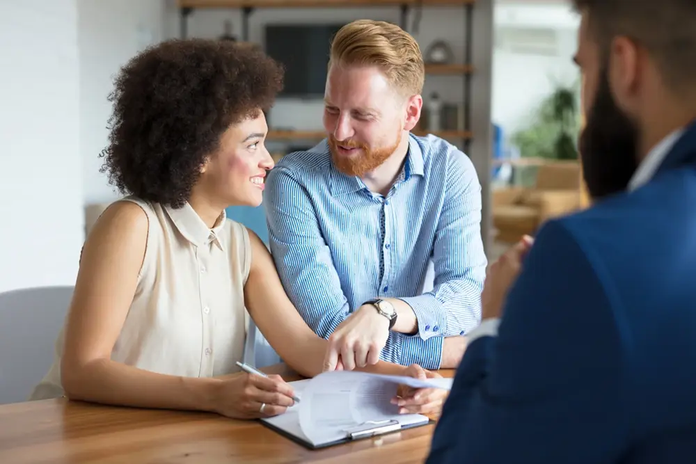 Man and woman signing paperwork