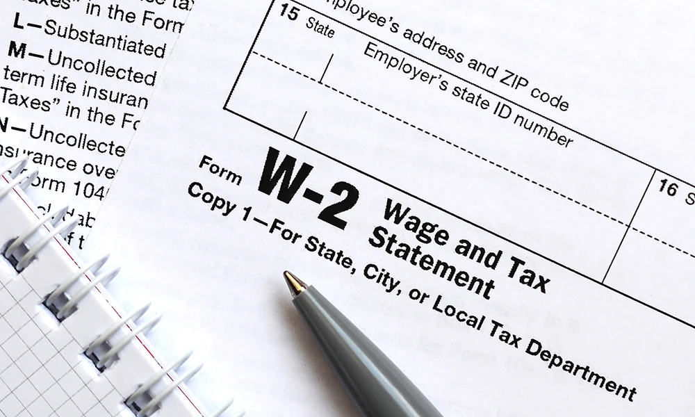 Wage and Tax Statement and a pen