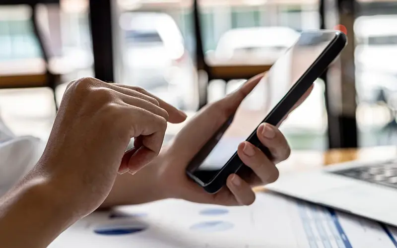 Close-up shot of holding a cell phone