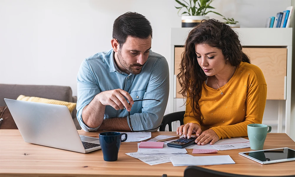 husband and wife reviewing financials 