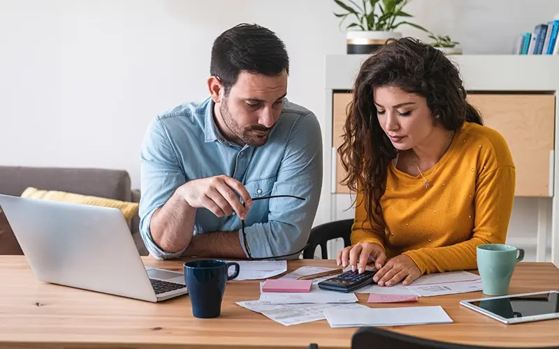 husband and wife reviewing financials 