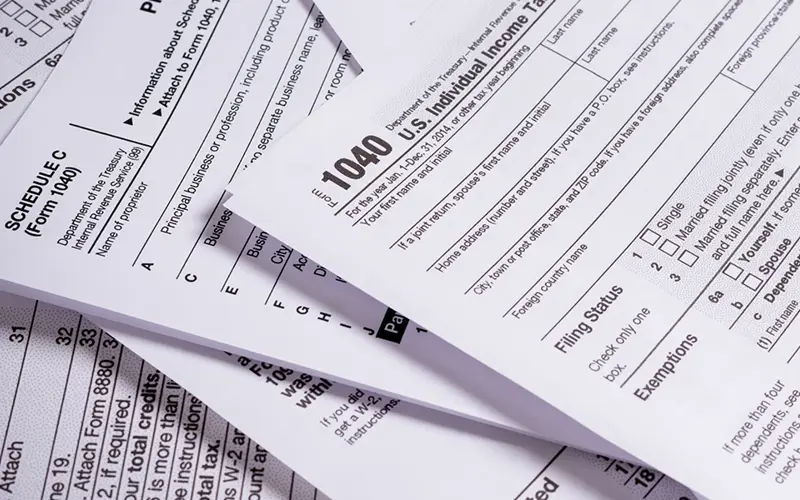 pile of paper tax forms